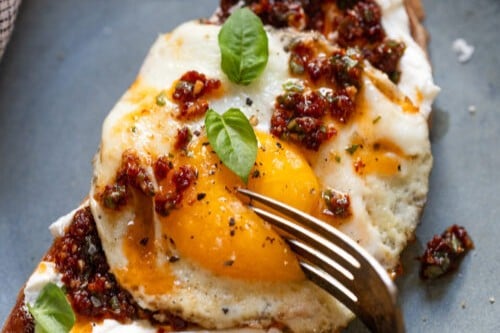 Herb-Whipped Goat Cheese with Harissa, Poached Eggs, and Toast